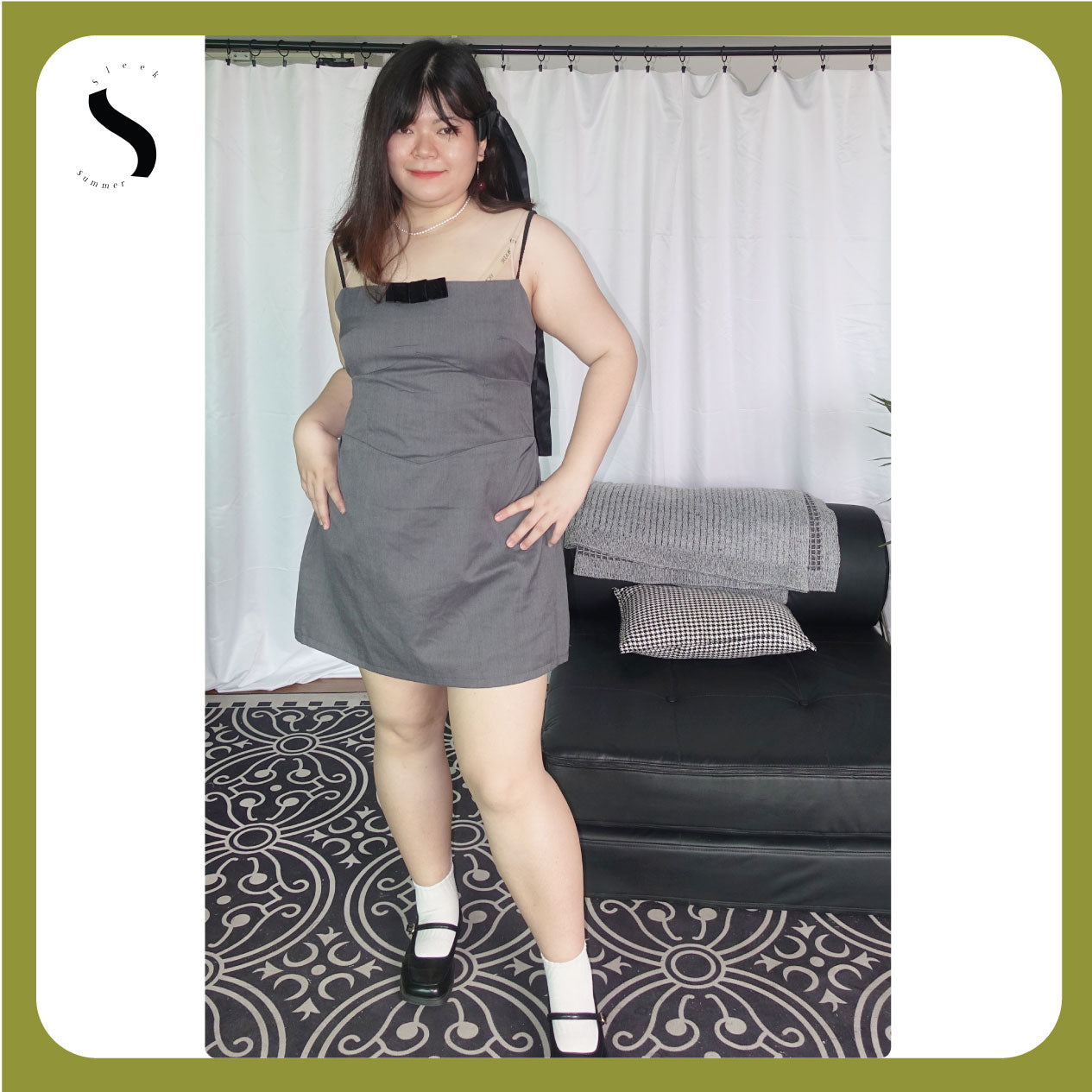 Plus-size grey A-line mini dress with spaghetti straps and a bow