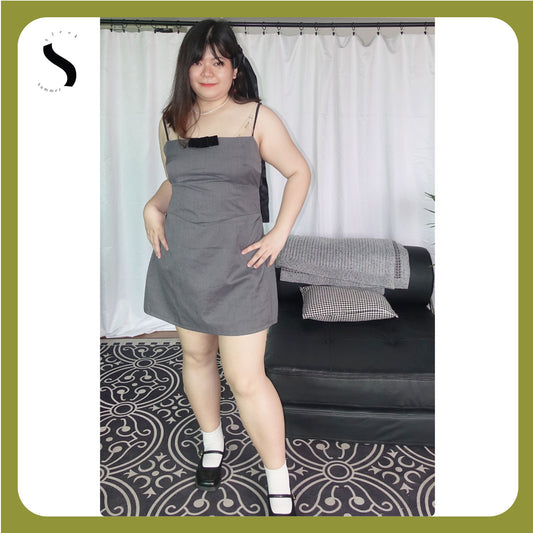 Plus-size grey A-line mini dress with spaghetti straps and a bow